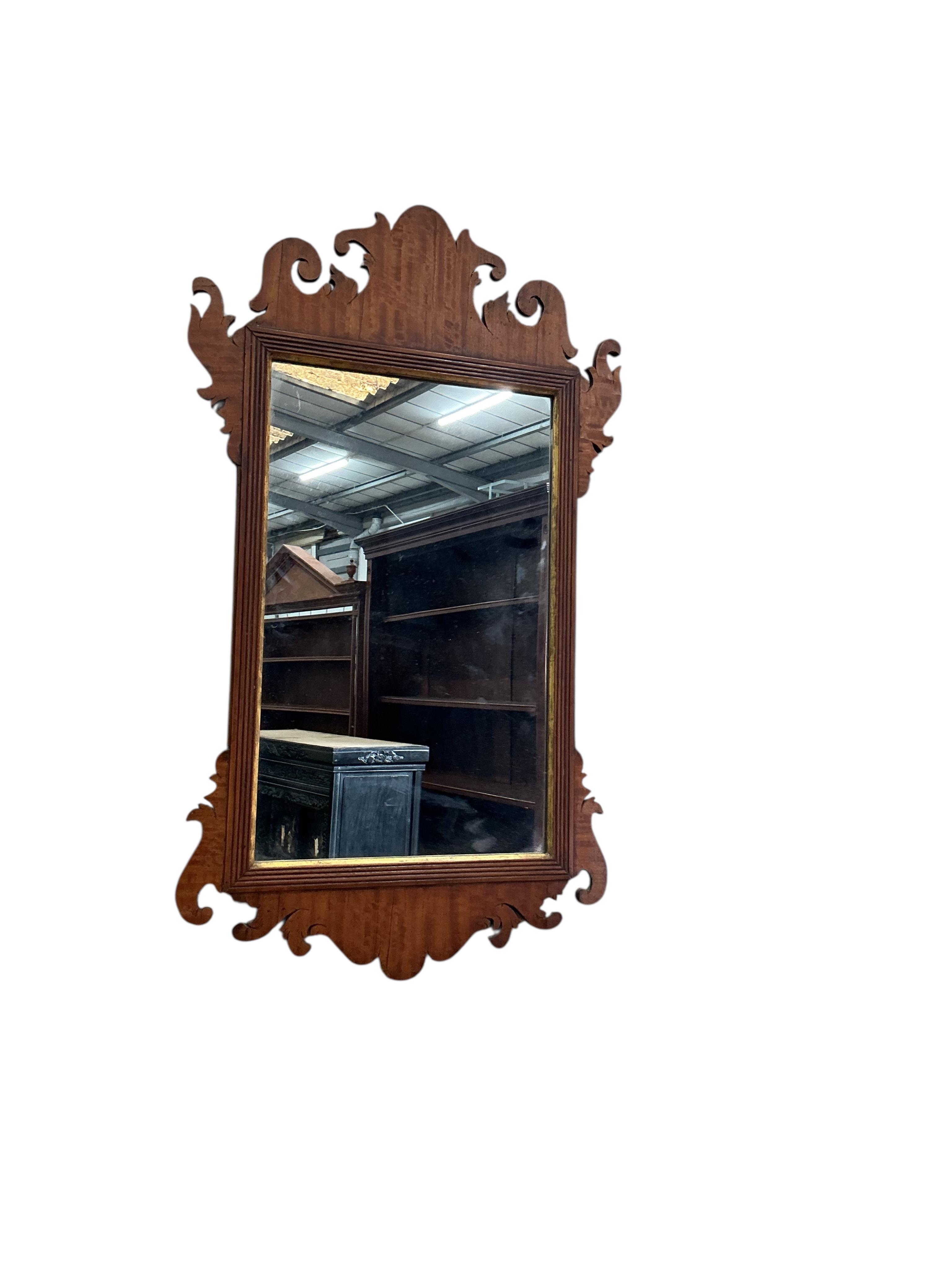A George III style satinwood fretcut wall mirror, width 36cm, height 64cm